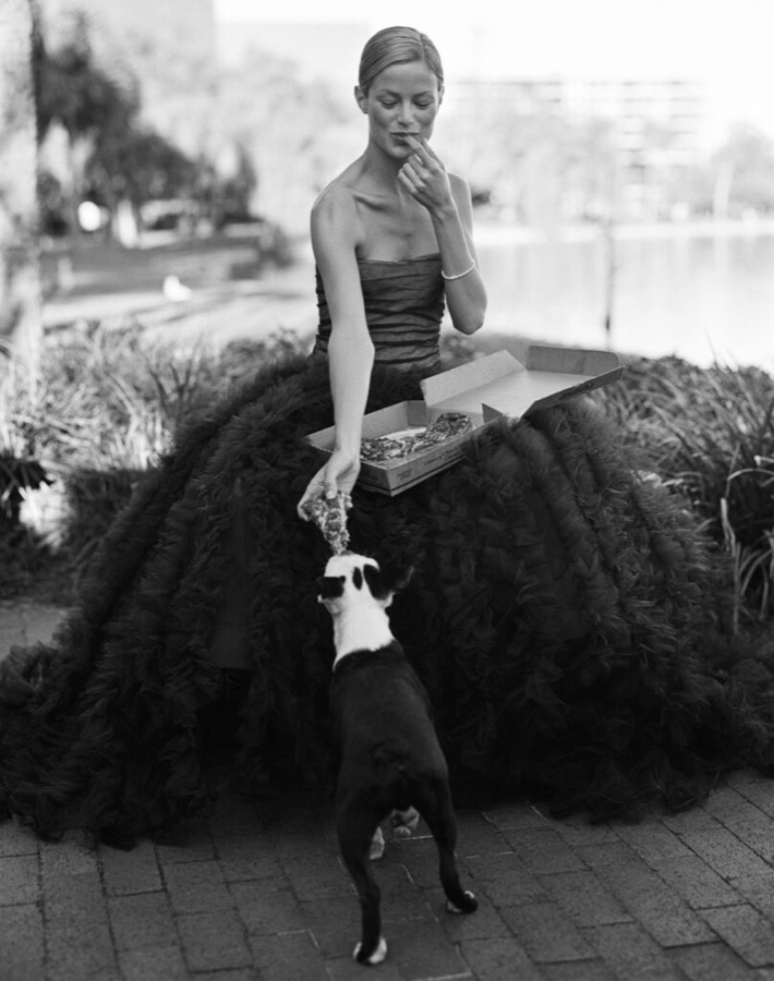 Bruce Weber, Carolyn Murphy sharing a pizza with her dog, Orlando, Florida, 1998