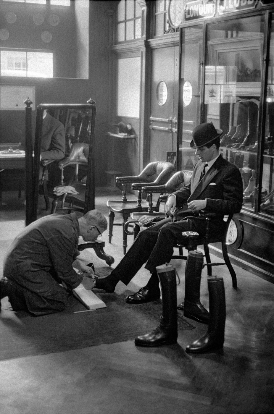 Frank Horvat, Customer at Lobb's shoe shop, London, 1959